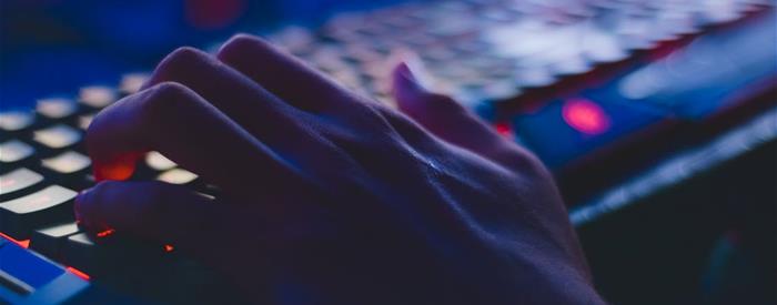 hands on backlit keyboard