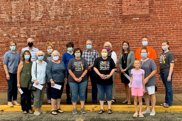 Group of recipients of the 2020 Orell Farley Foundation Grant in front of red brick wall