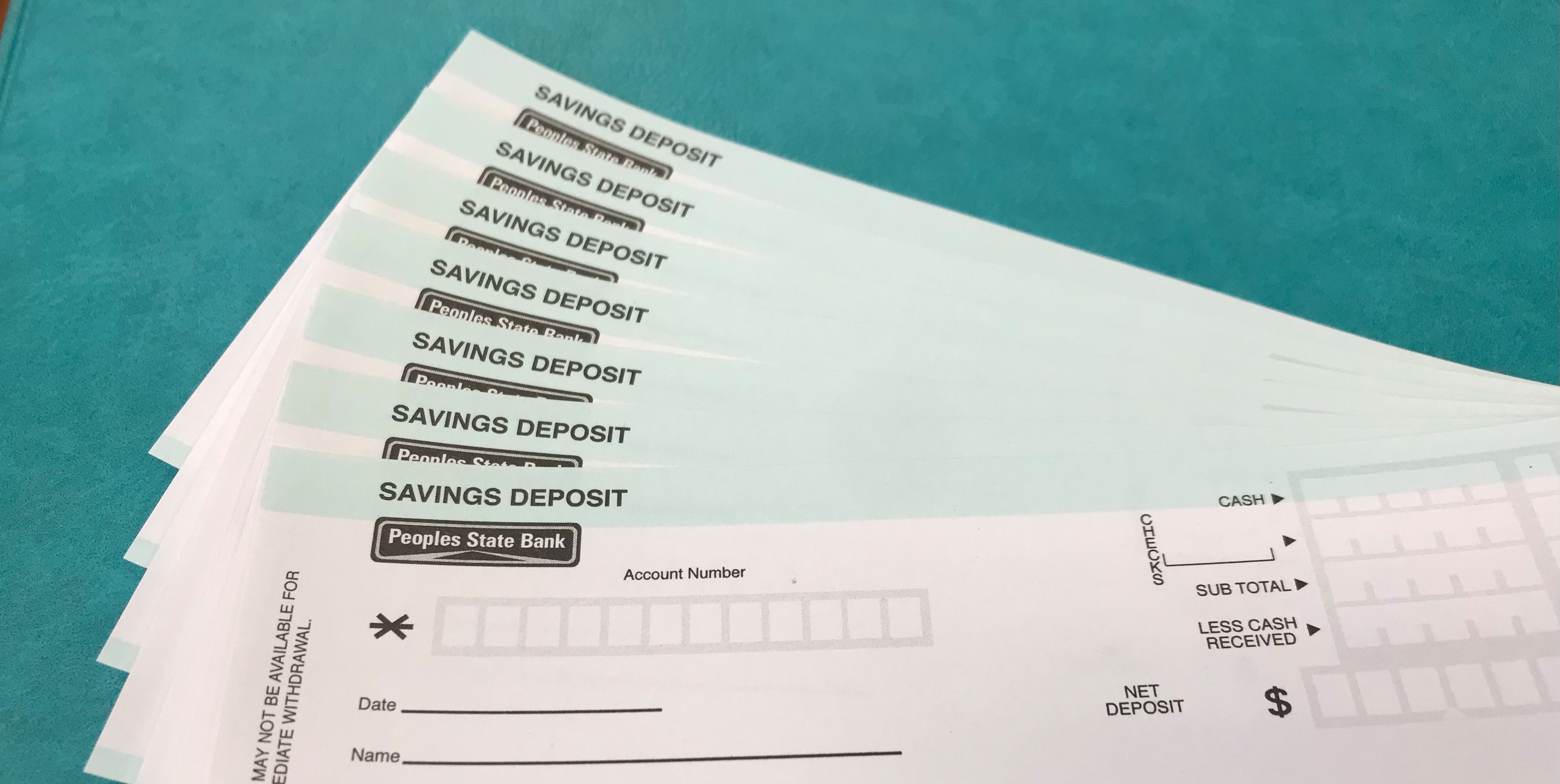 paper savings account deposit slips